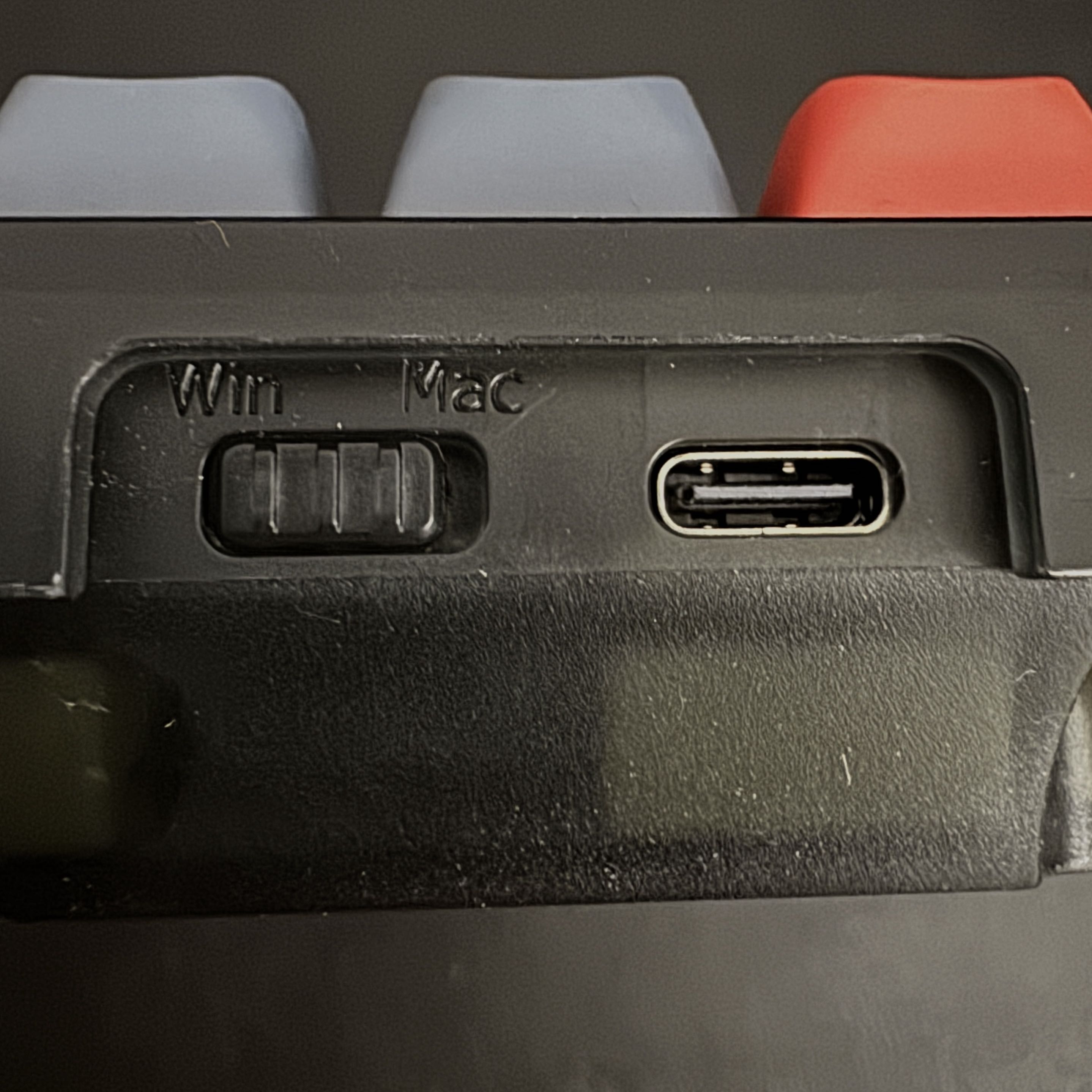 This is the back of the Keychron V2, a keyboard I used to use before my current Yunzii one. It's compatible with Mac and Windows, so I'd use it with my iPad and PC. This switch was the only way to know which mode you're on, with no light indicators or otherwise, which became a small point of friction for me, so I considered using it for this activity.