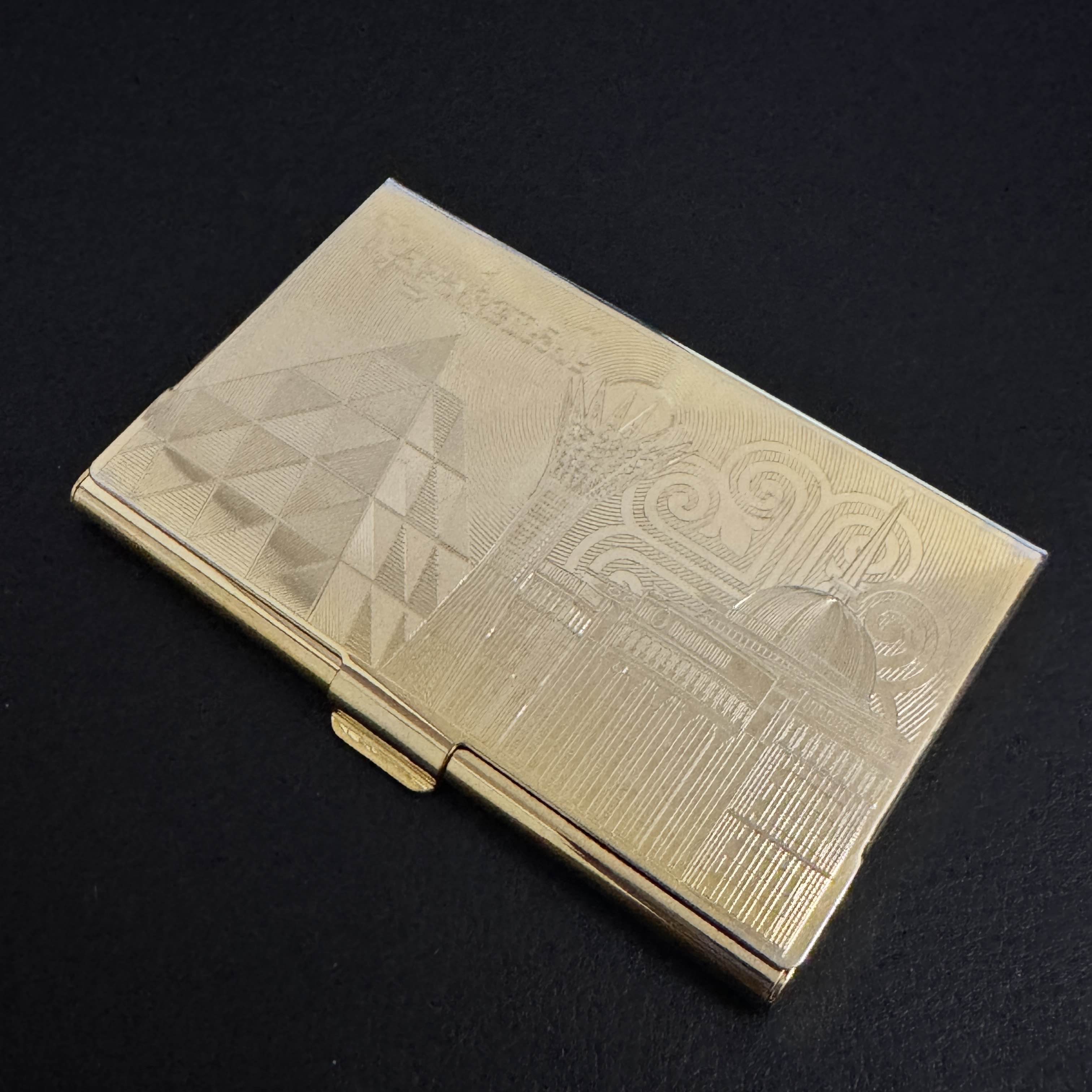 This is my makeshift wallet until I can get an actual slim wallet. It's originally meant to be a business card holder. The design on the front is an engraving of Astana&mdash;Qazaqstan's capital.