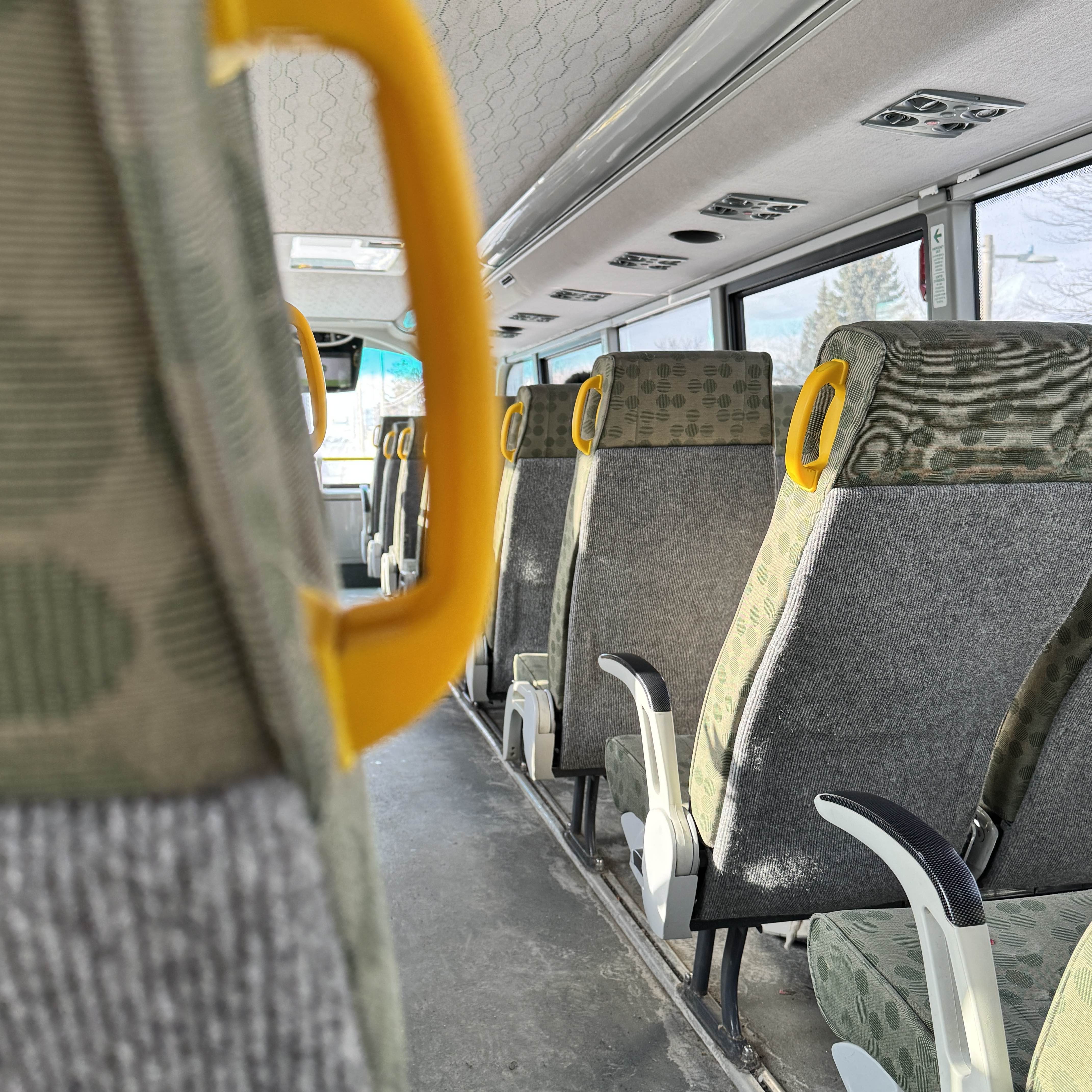 Once I'm on the bus, there's a variety of sounds around me: other people talking to each other or over the phone, the hum of air conditioning, phone notifications, the bus engine roaring, the bus jumping on bumpy roads, stop announcements, and more.