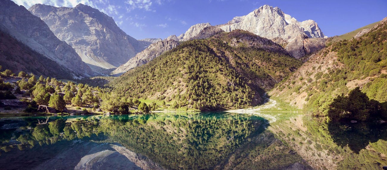 Image carousel of Central Asian landscapes.
