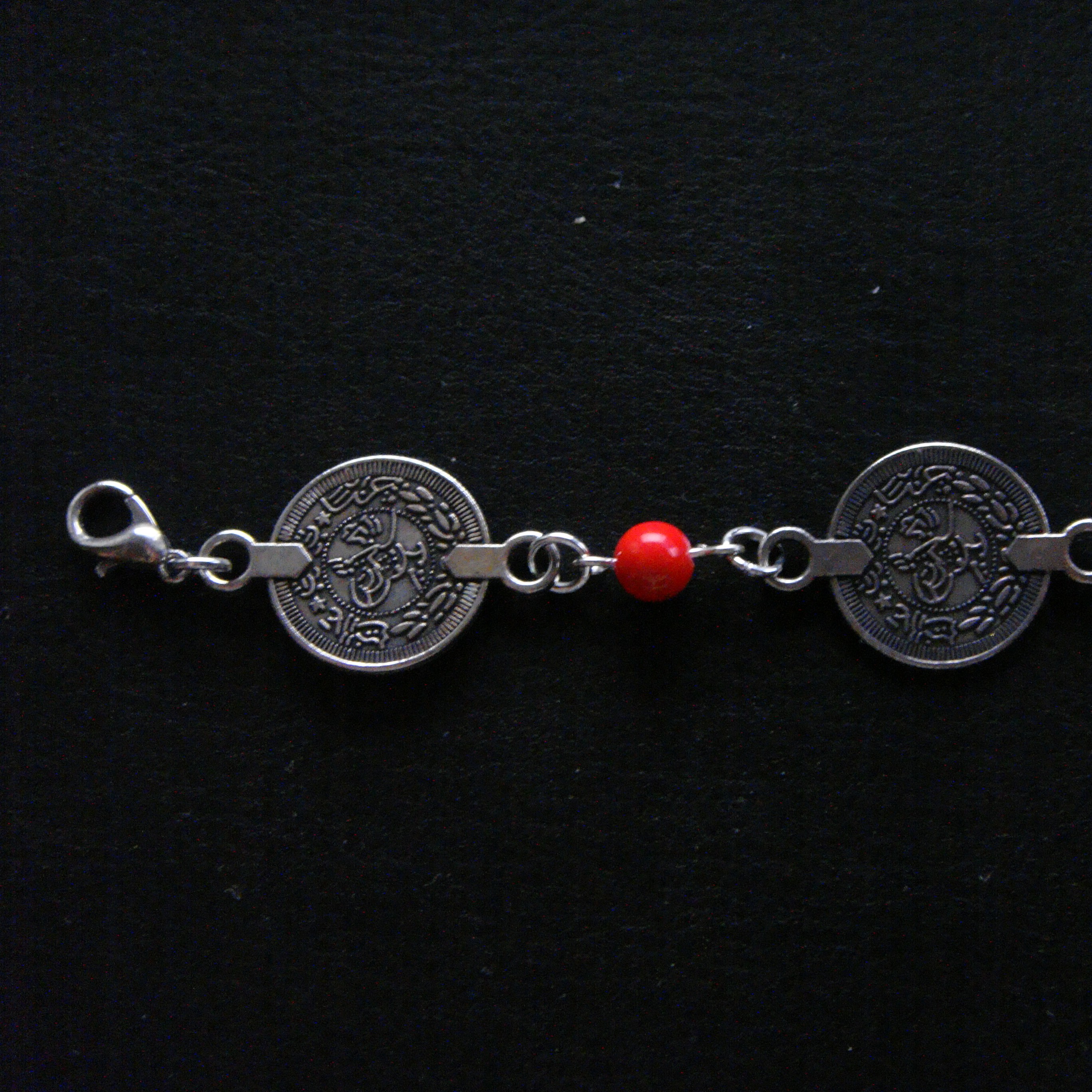 A Qazaq shashbau clipped onto braids for decoration.