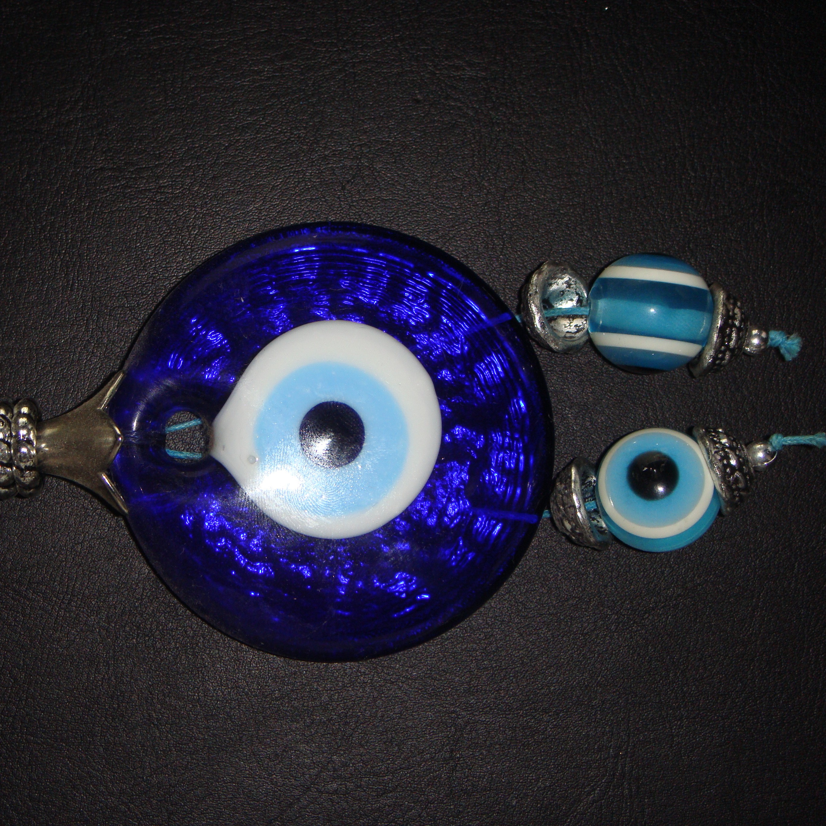 Evil eyes are an important aspect of Qazaq culture. Once they break, you're not allowed to fix them—the fact that they broke means they protected you all it could.